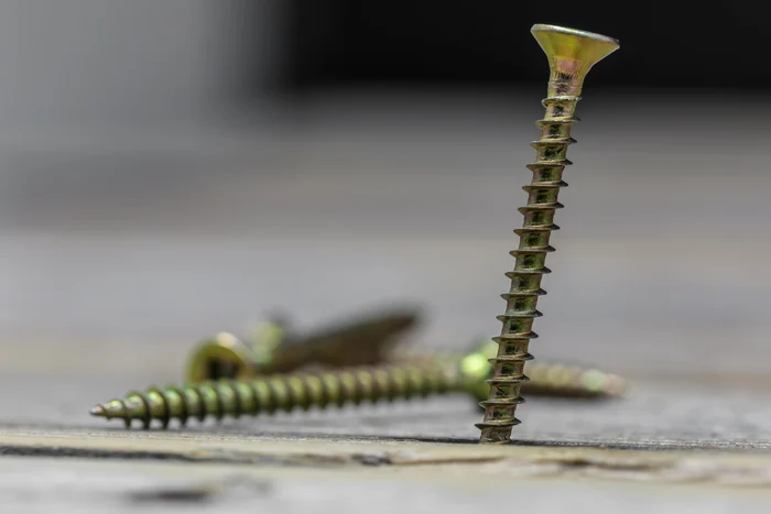 3ea07112-a917-40c7-850f-e27da2f72864-screws-wooden-wall.jpg